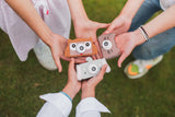 odalmix of elephant, owl and cat kids digital cameras, children are holding the cameras in their hands