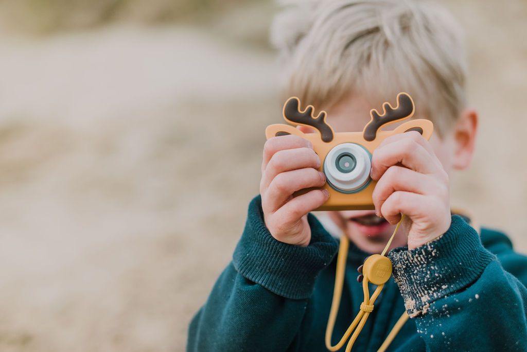 digital kids camera with brown dear sleeve and necklace
