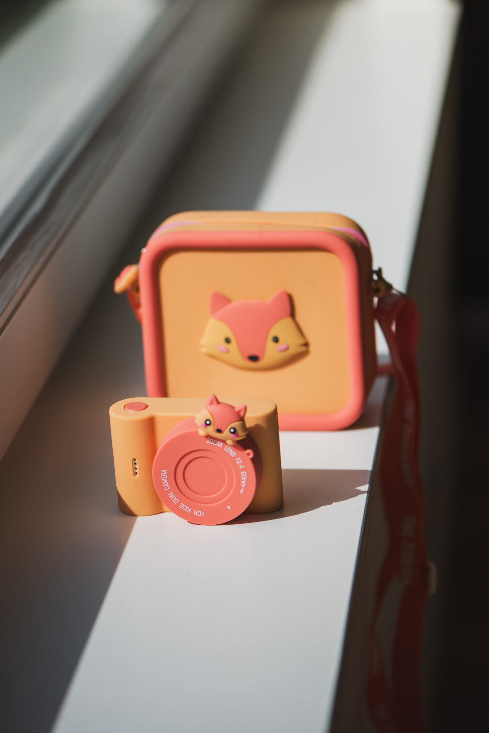 silicon bag fox and urban zoo fox digital kids camera, standing next to the window