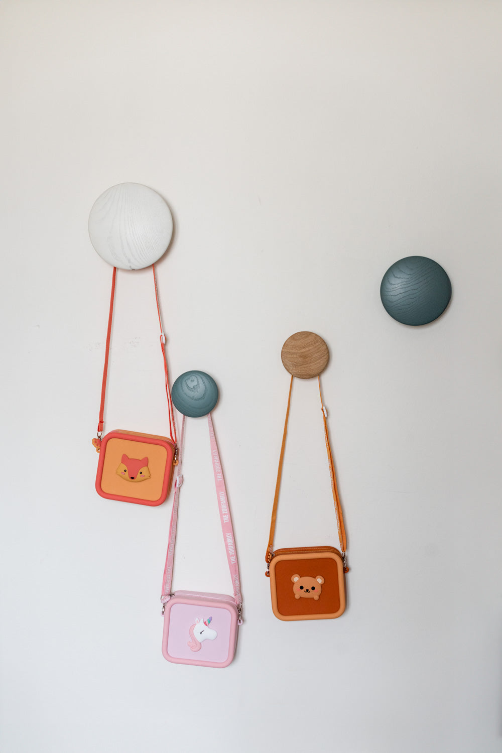 silicon bags fox, unicorn and bear, hanging at coat rack