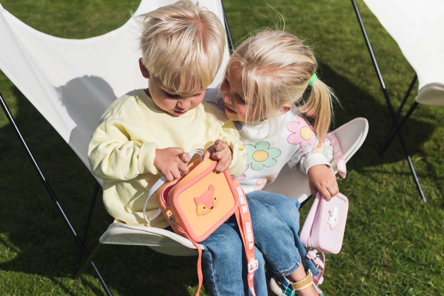 silicon bag fox and unicorn, kids sitting in a chair in the garden