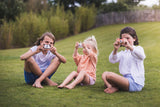 odalpenguin, fox and penguin kids cameras, children sitting in garden, holding cameras and making a picture